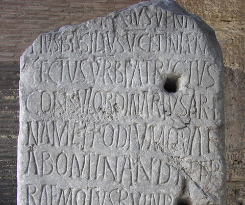 latin inscription at colosseum
